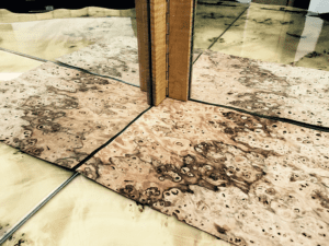 A hinged mirror is a tool used to simulate a 4 piece match in order to select the best veneer for the job.