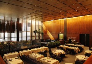 An interior image of Philip Johnsons famed Four Seasons Hotel Restaurant showing off the beautiful sequenced french Walnut veneer.