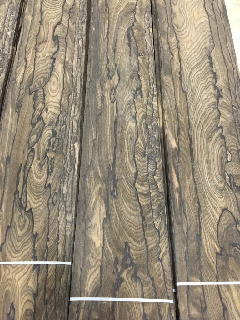 A sampling of Ziricote that is all heartwood which, in addition to the typical ziricote island grain, has a repatition of inner and overlapping growth rings.
