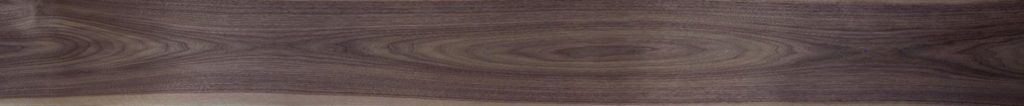 Flatcut Walnut veneer with island or "football" shaped cathedral grain structure.