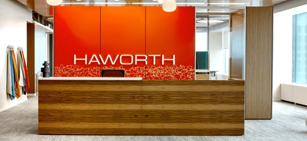 A reception desk made of book-matched sappy Red Gum wood veneer.