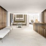The reception or entryway into the Geiger Showroom withs either wall being clad in Birdseye Paldao veneer.